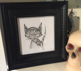 City Kitty is an original graphite drawing by Rob Reger. Framed in a vintage black frame it measures 9" x 9". Signed by the artist. 