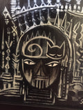 detail shot of the Emily gate. stairs lead up to an impassive mouth and a triangular nose split in two. her eyes look angry, and a cat is curled up sleeping on her forehead. there are3 pillars to either side of her and spikes above to keep out trespassers